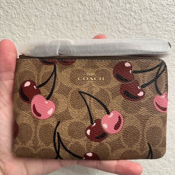 Coach Handbags - Coach Corner Zip Wristlet In Signature Canvas With Cherry Print